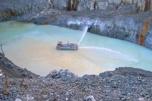 A boat purifies the water in a lake.
